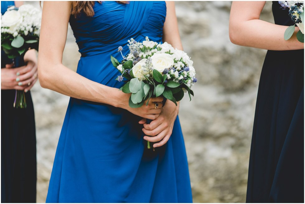 Bridesmaid holding their bouquet during the Goldie Mill Ruins wedding ceremony