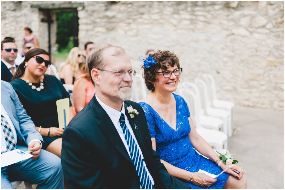 Brides parents smiling during the Goldie Mill Ruins wedding ceremony