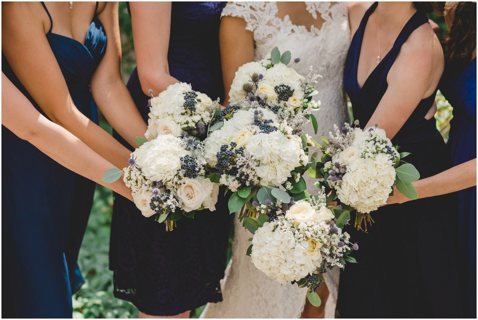 White and navy bridal bouquets all together