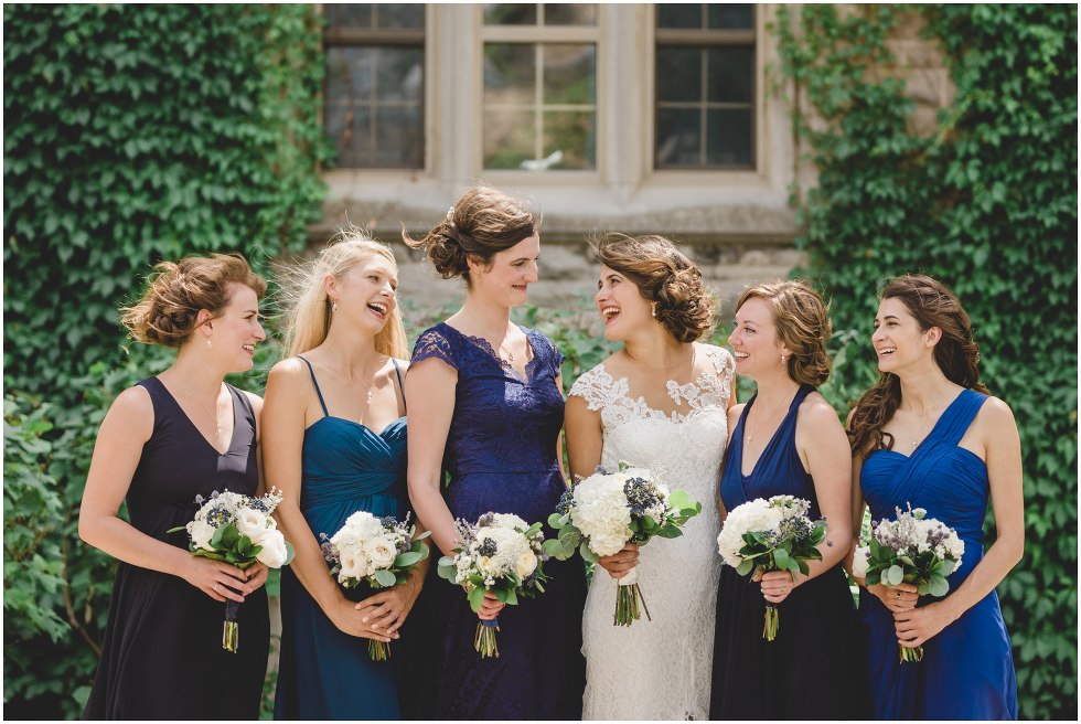 Bride and her bridesmaids smiling and laughing at the University of Guelph