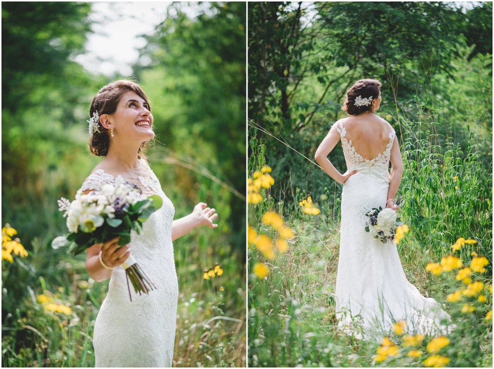 Bride smiling in a field with tall grass and yellow flowers
