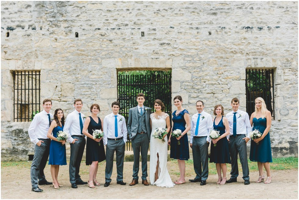 Wedding party standing together in front of Goldie Mill Ruins
