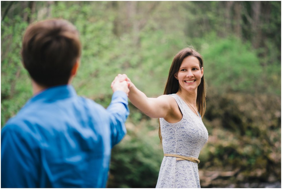 Bride to be smiling at her fiance during their Hilton Falls engagement photos 