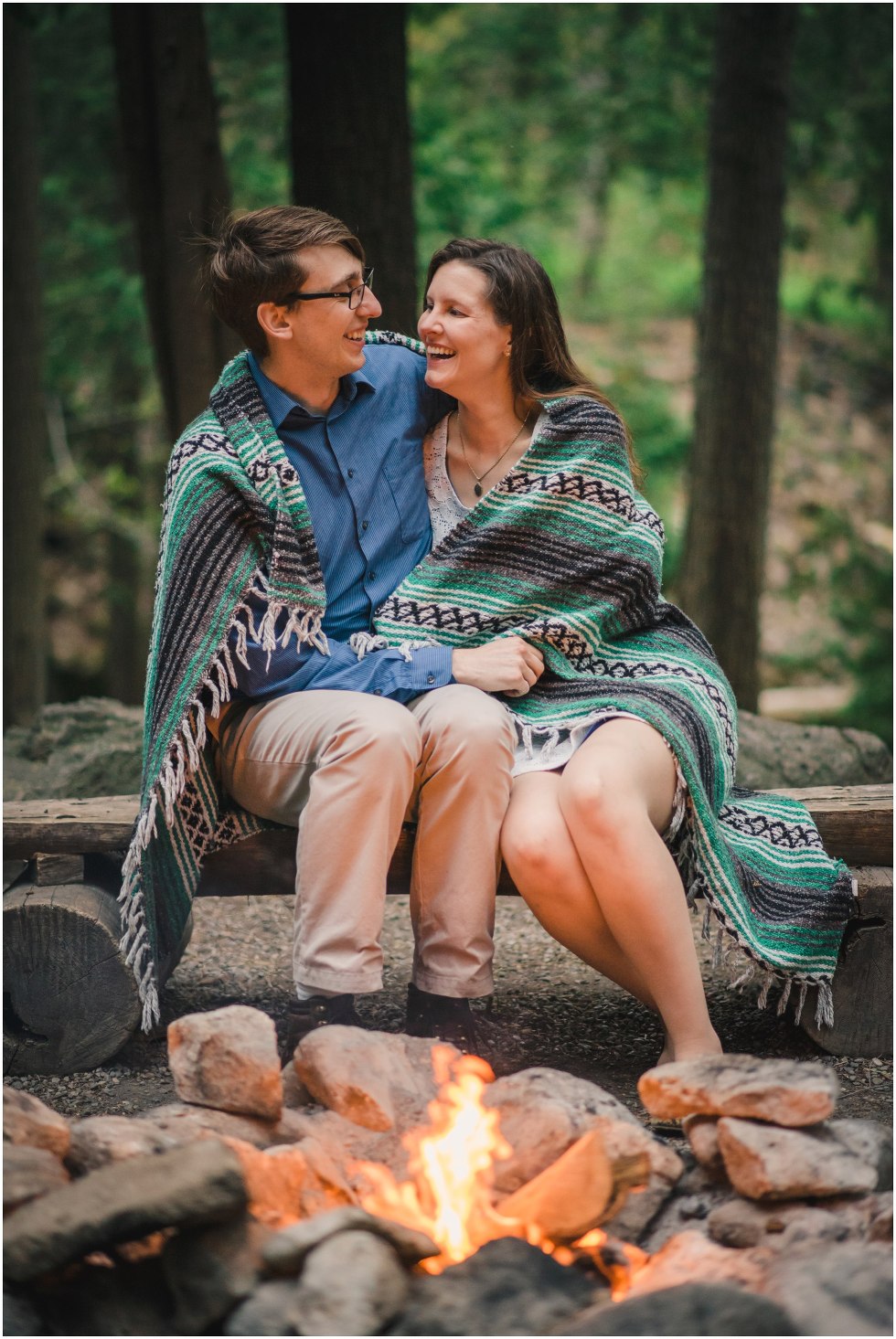 Couple smiling and laughing by the first for their Hilton Falls engagement photos