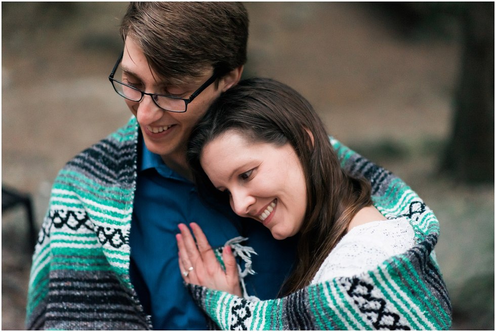 Couple wrapped up in a blanket for their Hilton Falls engagement photos