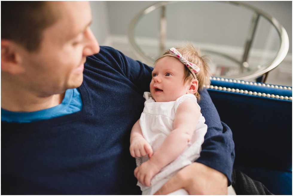 Dad looking at his daughter during their Toronto Newborn LIfestyle photos