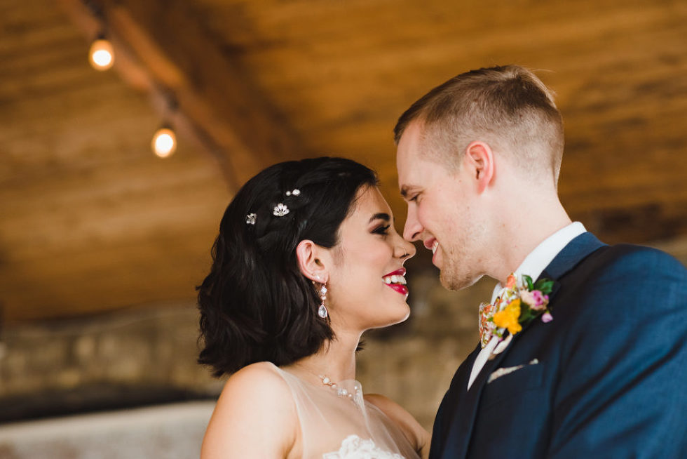 bride and groom smiling at each other in the Jam Factory Toronto wedding photographer Gillian Foster