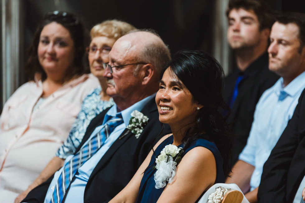 wedding guests reacting emotionally during ceremony Toronto Junction Craft Brewing wedding photography